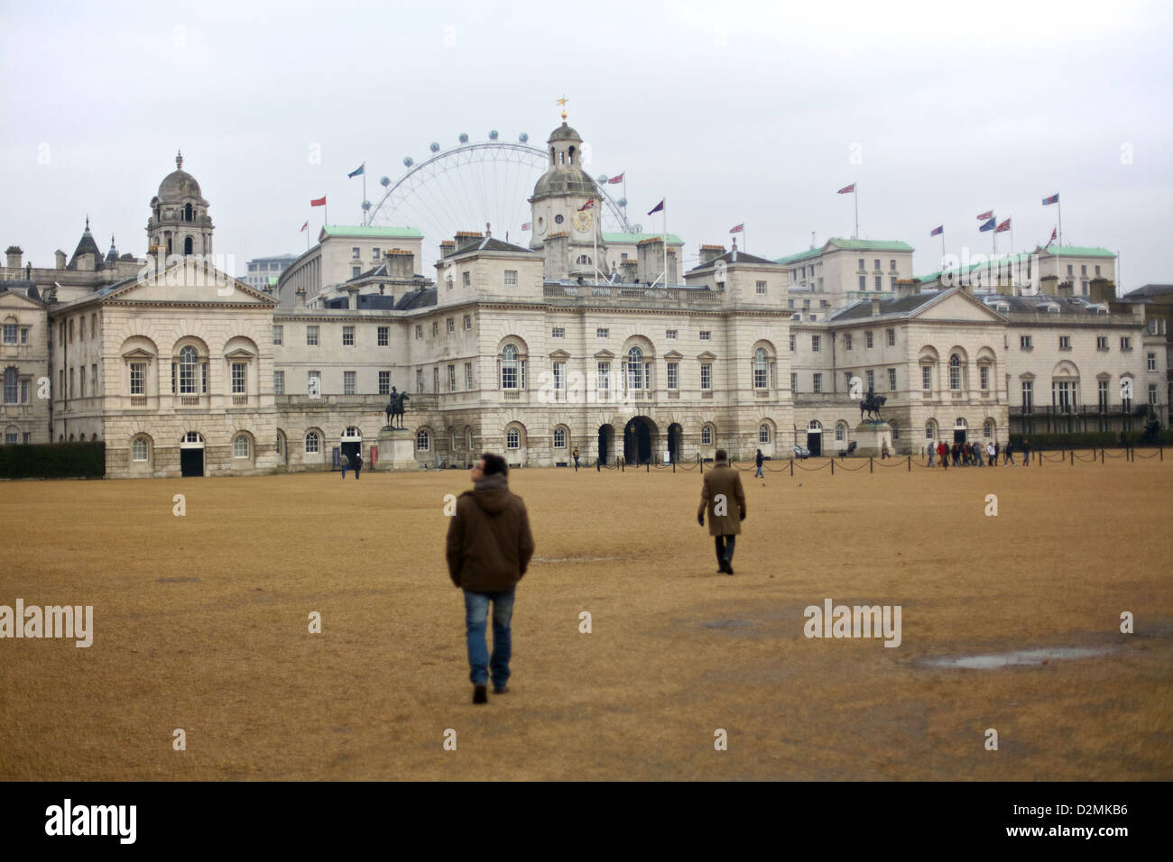 People walk across Horse Guards Parade field in London, England Stock Photo