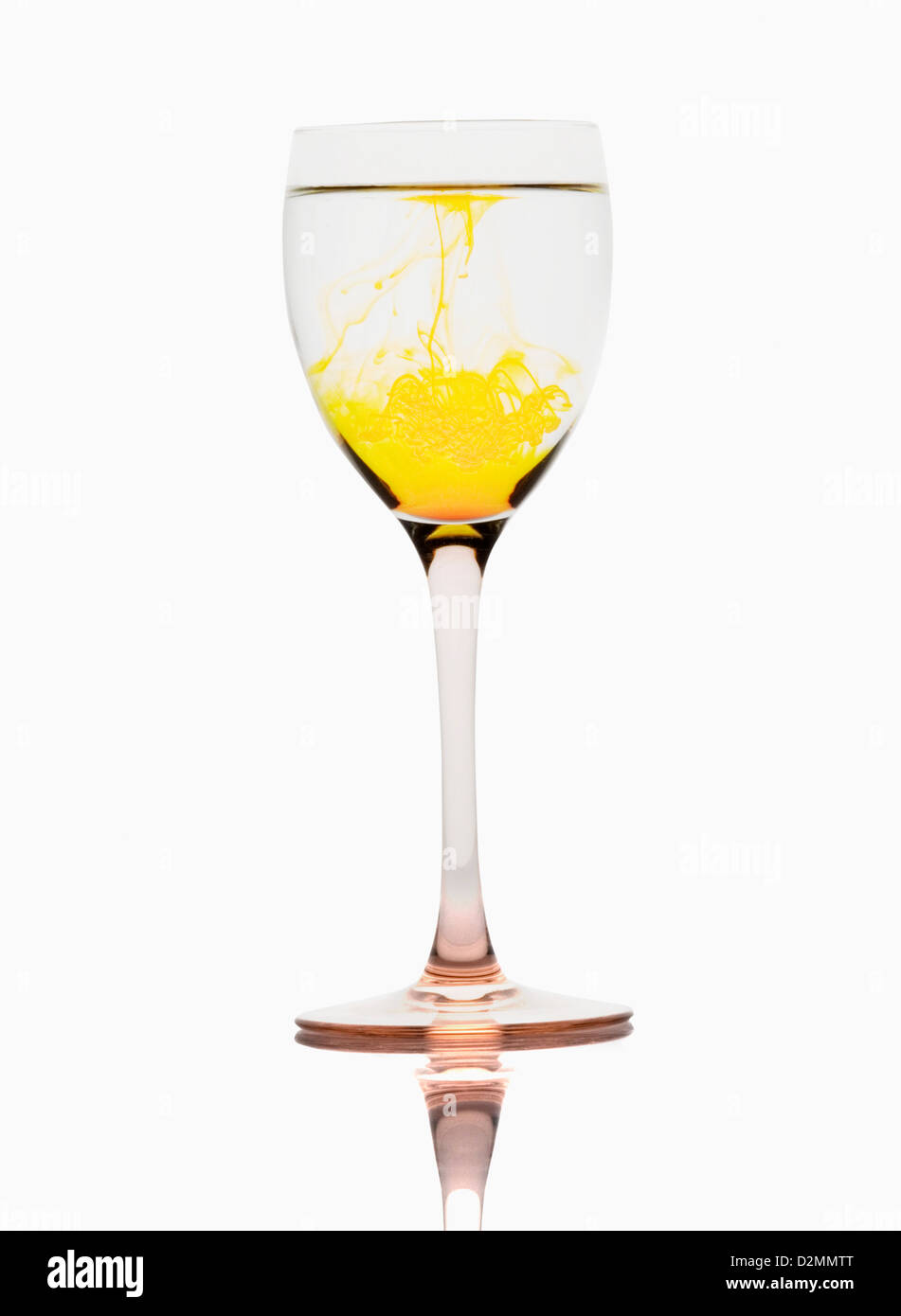 Yellow color streaks with water in a wine glass Stock Photo Alamy