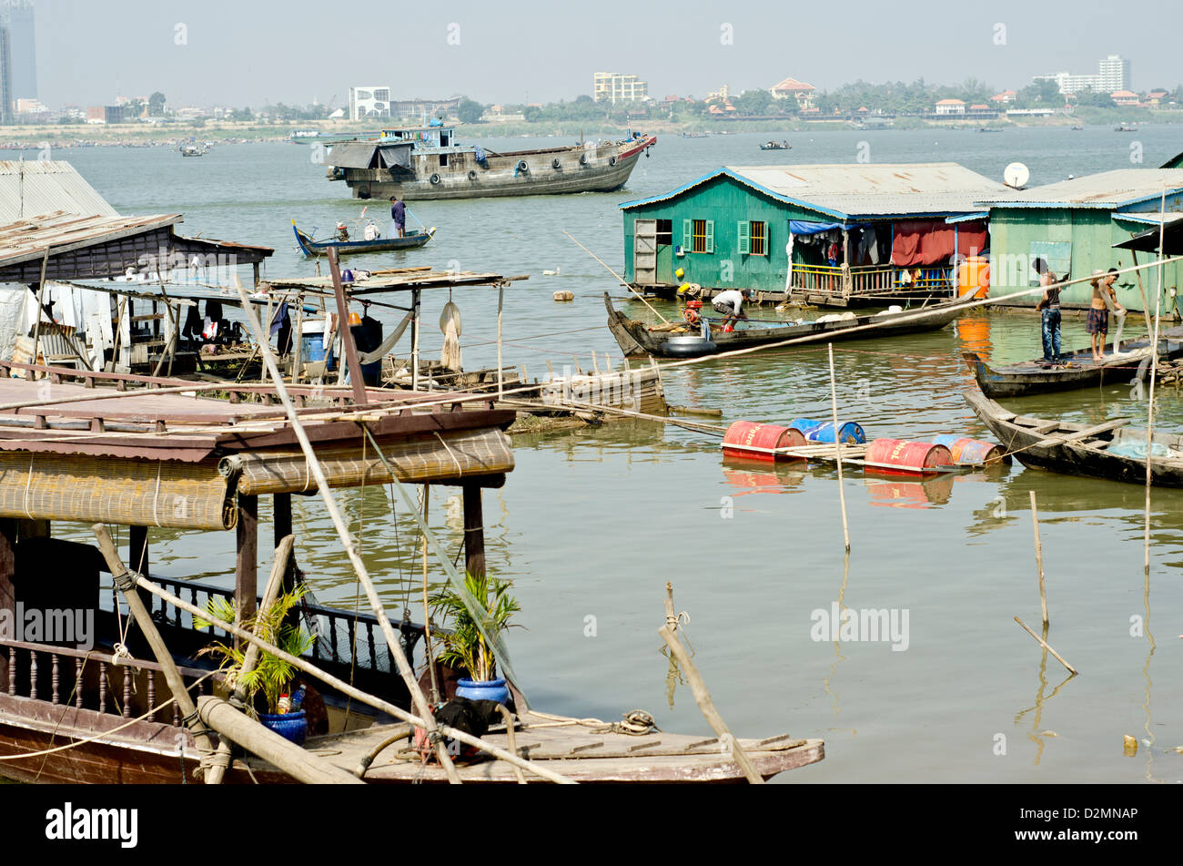 Floating village on the Mekong river in Phnom Penh ,only 500 meters from the city most expensive hotels. Stock Photo