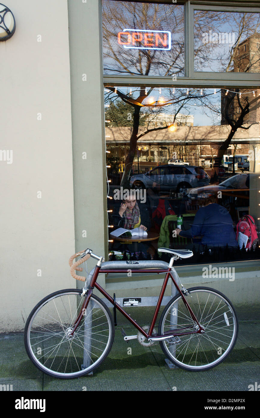 Bicycle parked outside a coffee shop in downtown Bellingham, Washington State, USA Stock Photo
