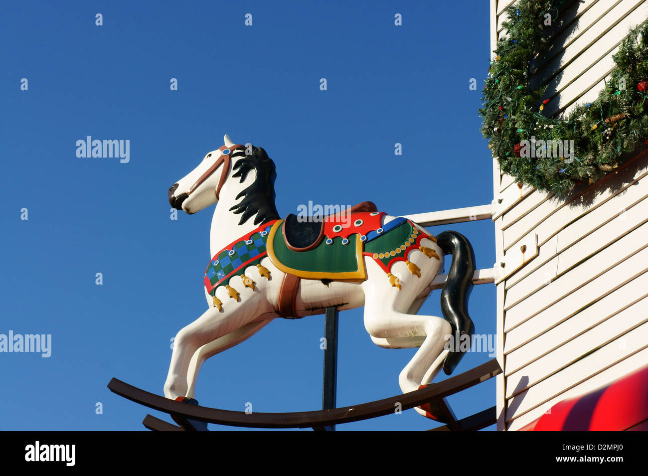 Colourful wooden rocking horse outside a toy store in Vancouver, BC, Canada  Stock Photo - Alamy