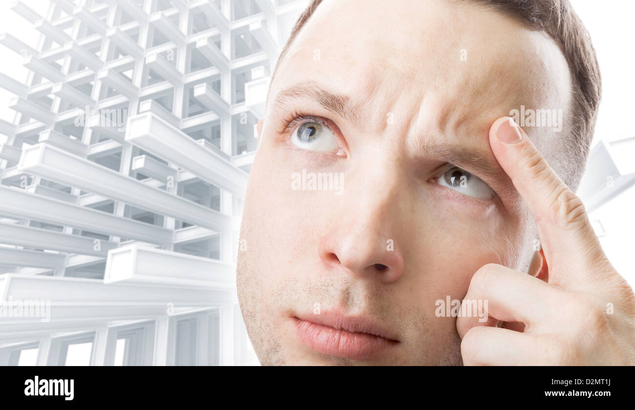 Young Caucasian man thinking above abstract construction technology background Stock Photo