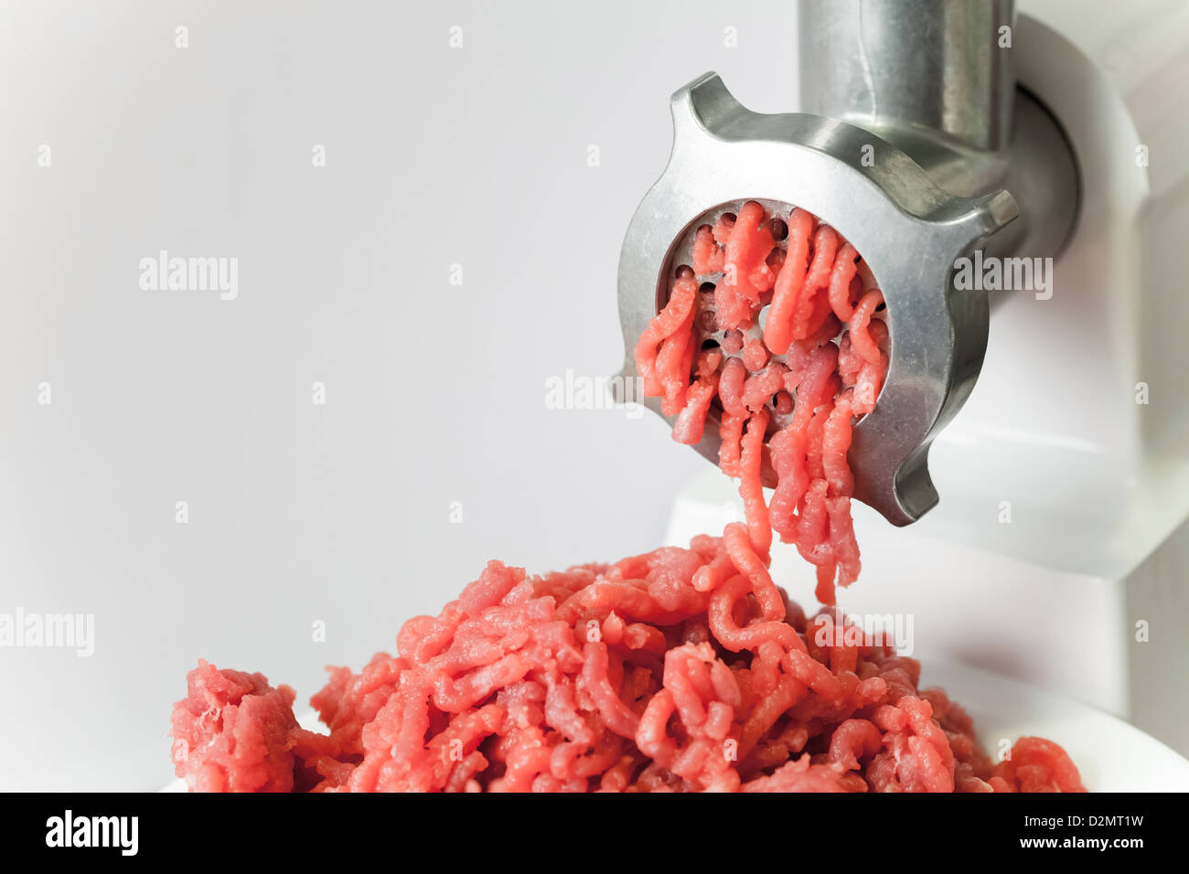 meat and grinder. Minced meat and meat grinder. Meat grinder machine  chopping uncooked ground meat Stock Photo - Alamy