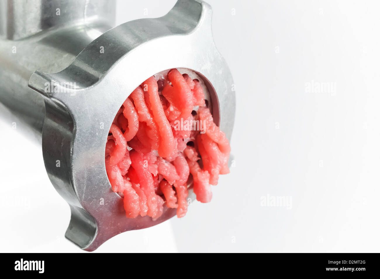 Closeup photo of mincer machine with chopped meat Stock Photo