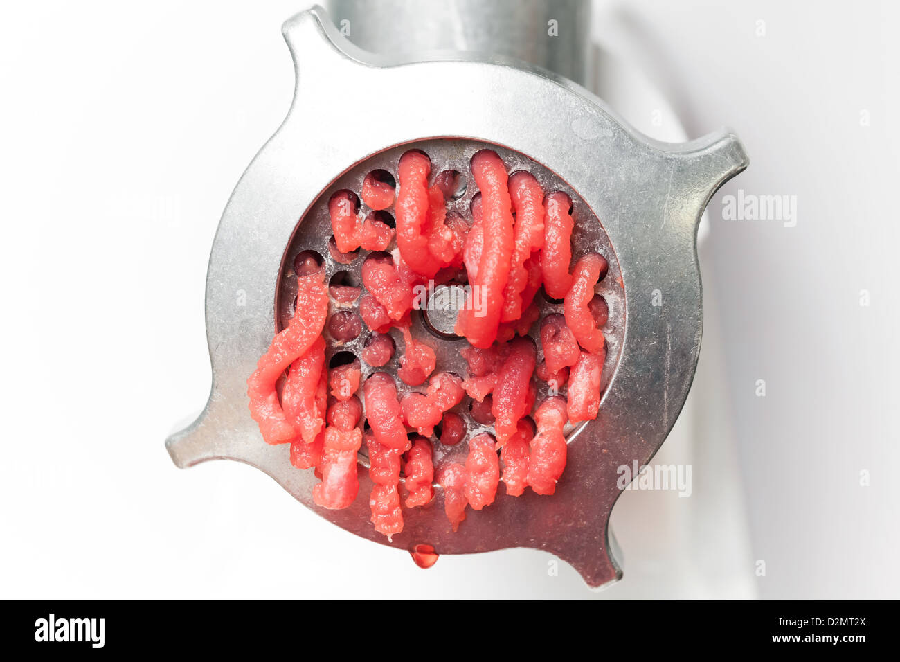 Closeup photo of mincer machine with fresh chopped meat Stock Photo