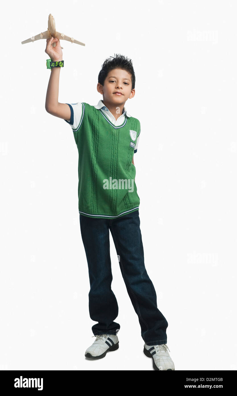 Portrait of a boy playing with a toy airplane Stock Photo - Alamy