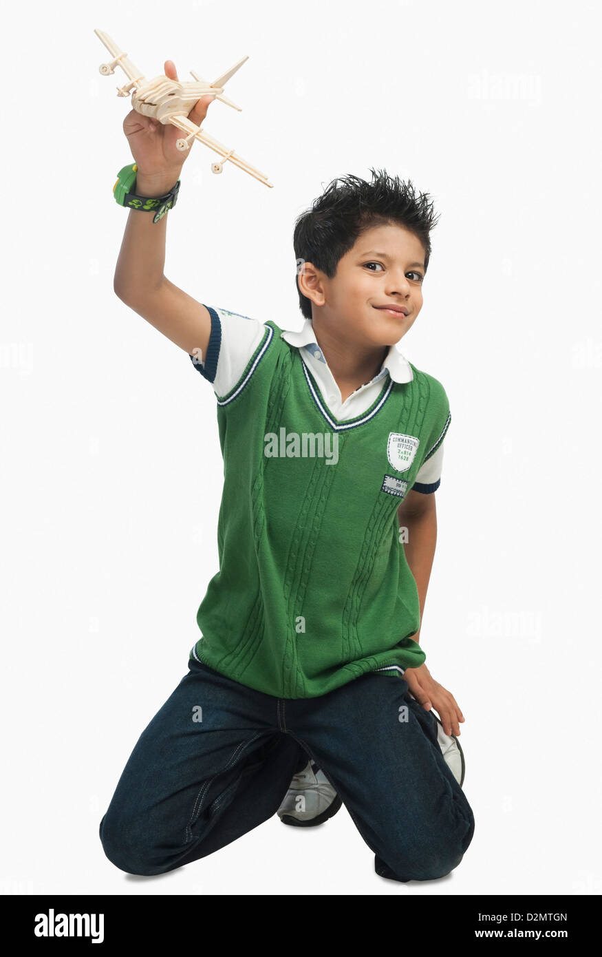 Portrait of a boy playing with a toy airplane Stock Photo - Alamy