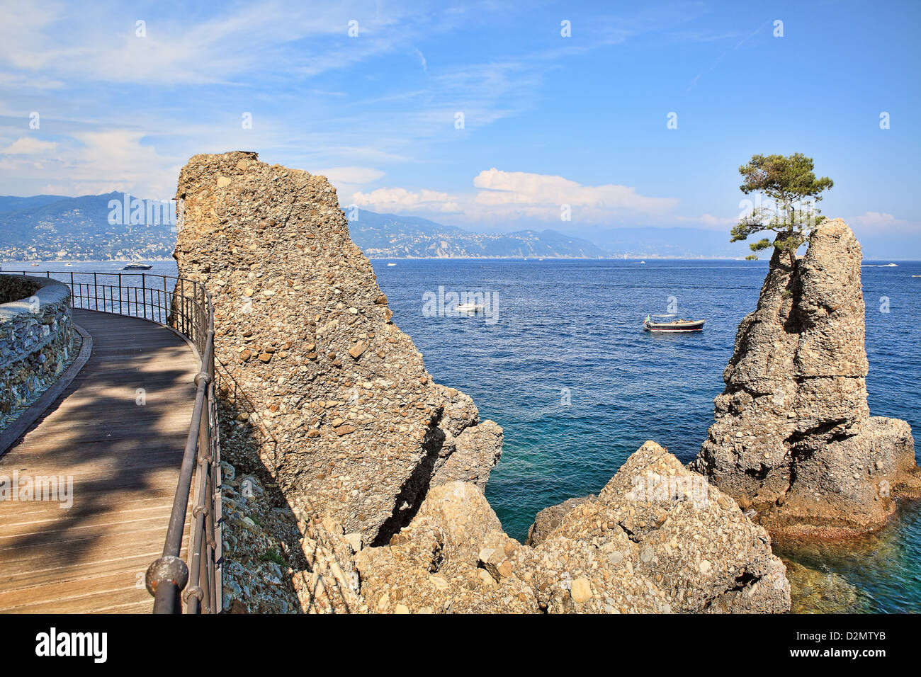 Wooden footbridge along the coast and rocks on Mediterranean sea near Portofino in Liguria, Italy. Stock Photo