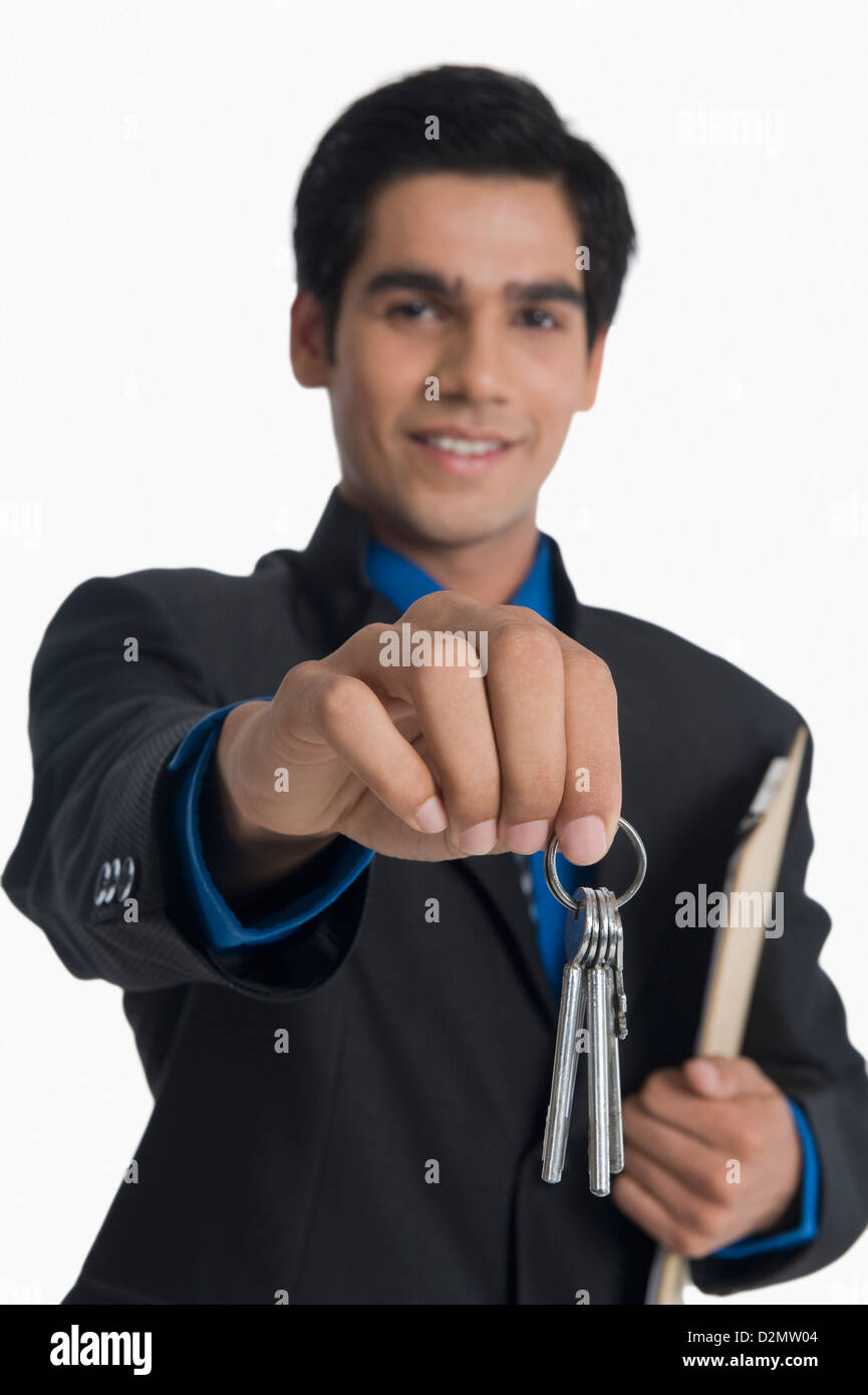 Real estate agent holding house keys Stock Photo Alamy