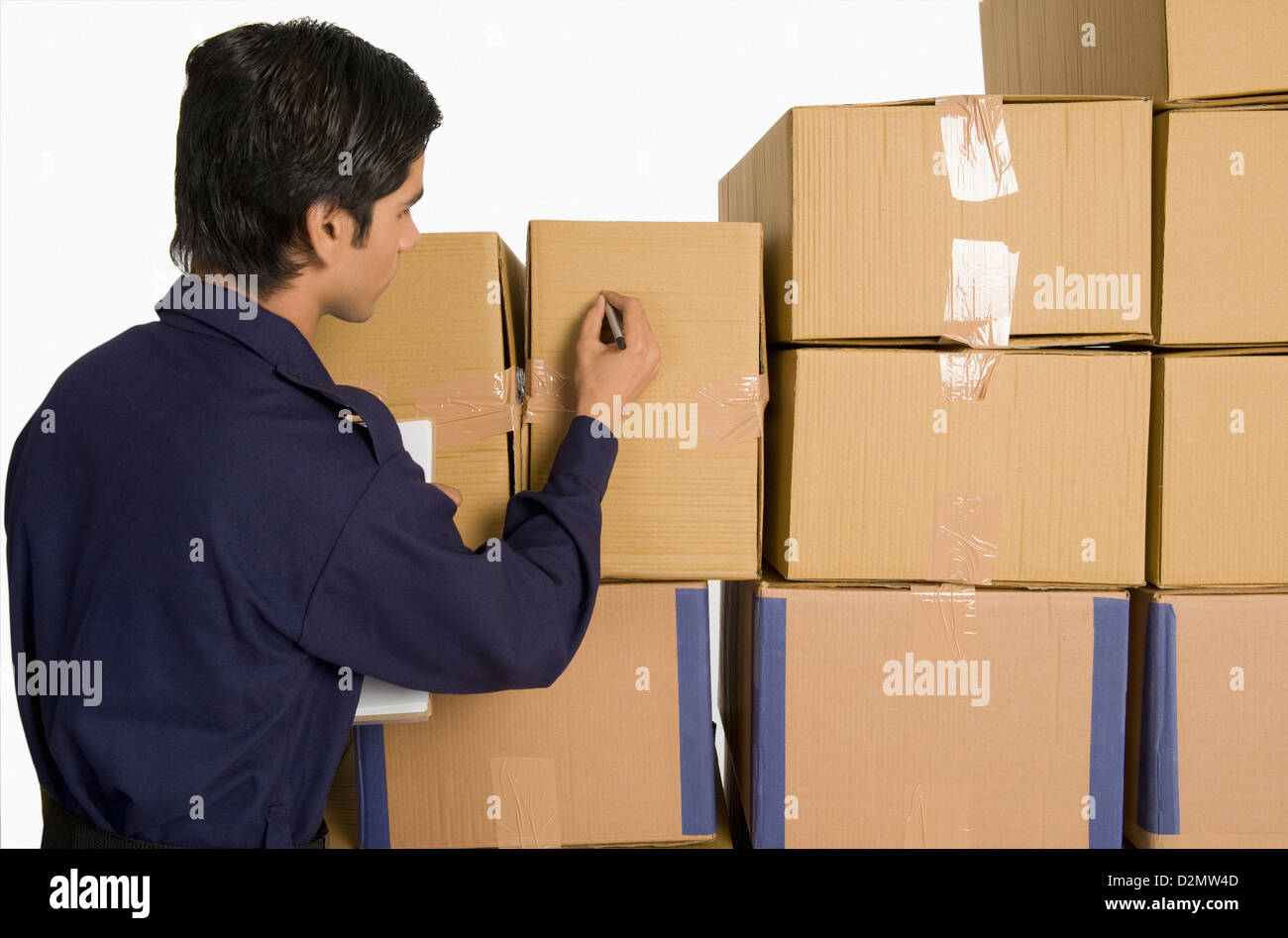 Store incharge counting cardboard boxes Stock Photo - Alamy