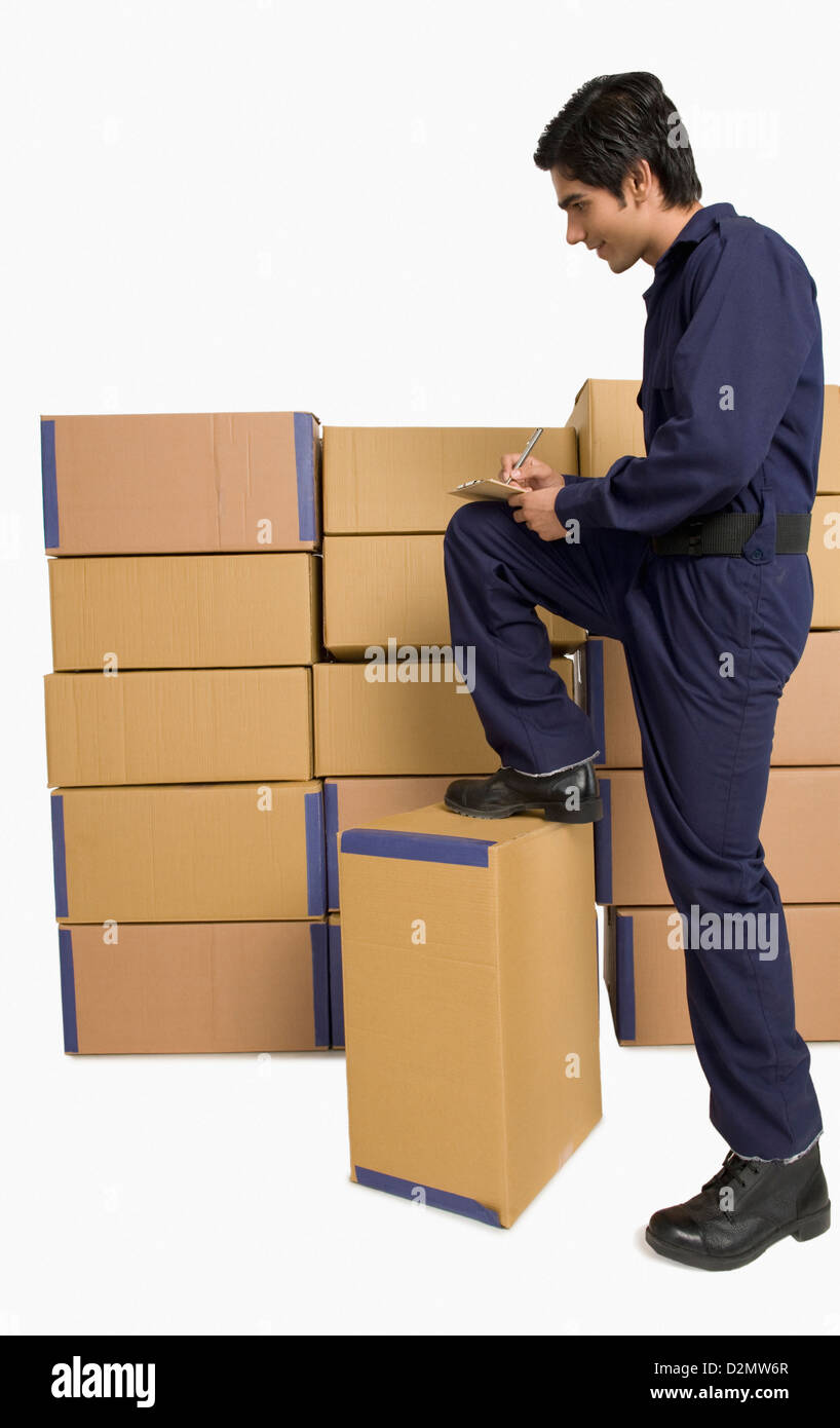 Store incharge checking inventory Stock Photo - Alamy