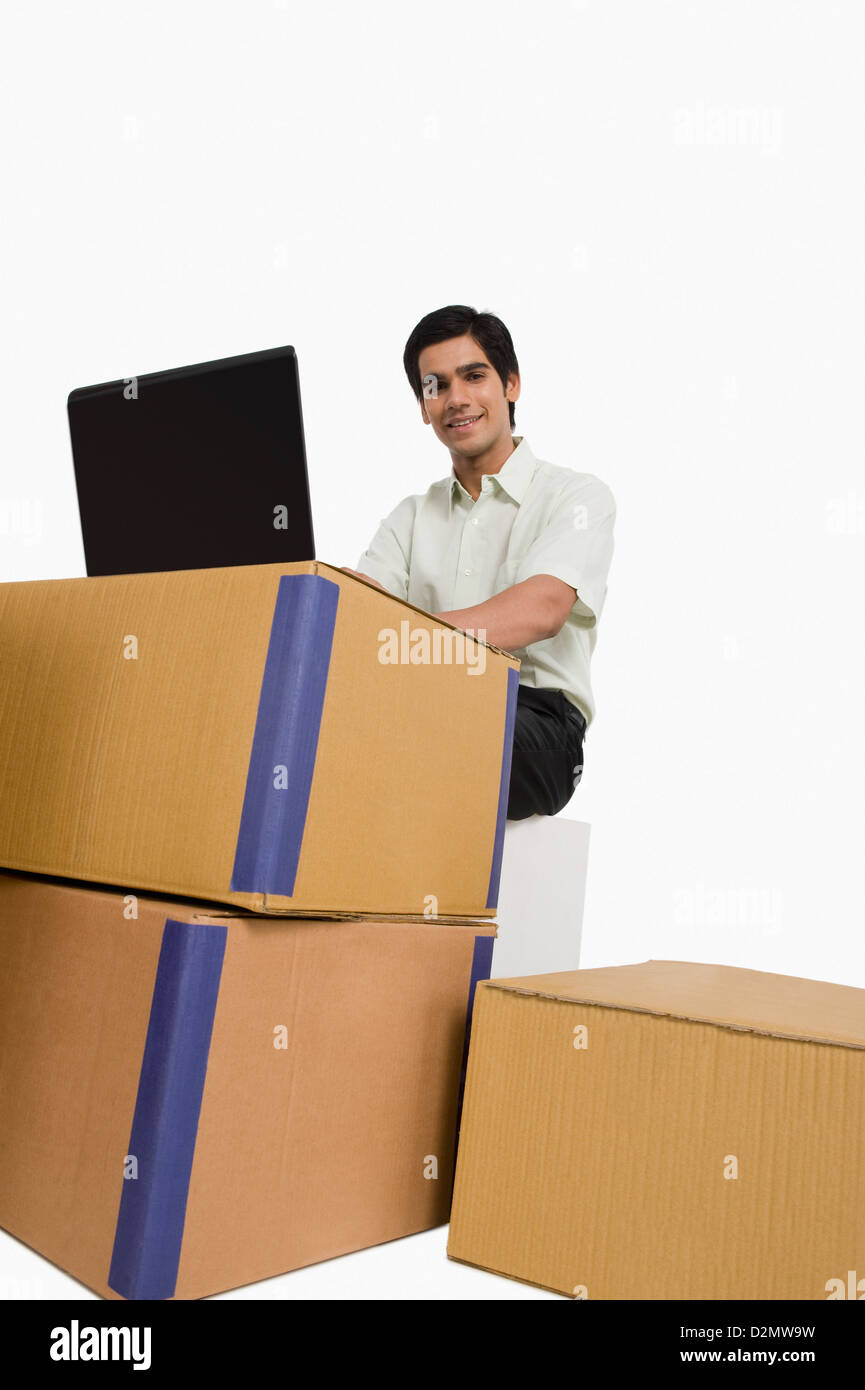 Store incharge using a laptop in a warehouse Stock Photo - Alamy