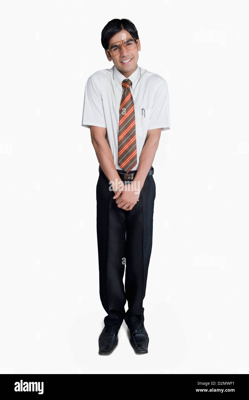 Man standing and looking shy Stock Photo - Alamy