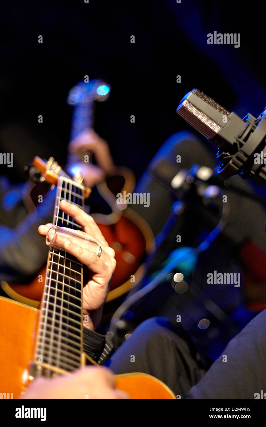 Two jazz guitars and microphone on stage Stock Photo