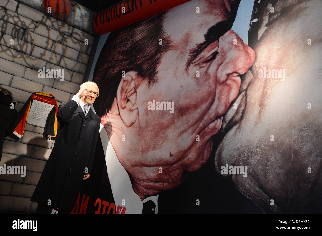The wax figure depicting Erich Honecker, former Chairman of the State Council of the GDR, is pictured in front of the image showing the 'socialist fraternal kiss' of Honecker and Leonid Breschnew at the wax museum Madame Tussauds in Berlin, Germany, 04 December 2012. Photo: Jens Kalaene Stock Photo