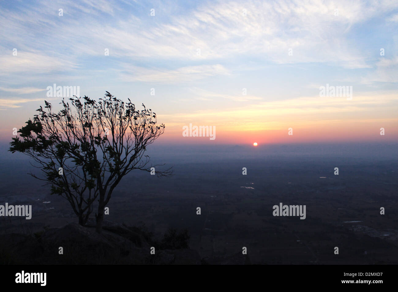 A Misty Sunrise at Kaurav Kunta Hills Stock Photo