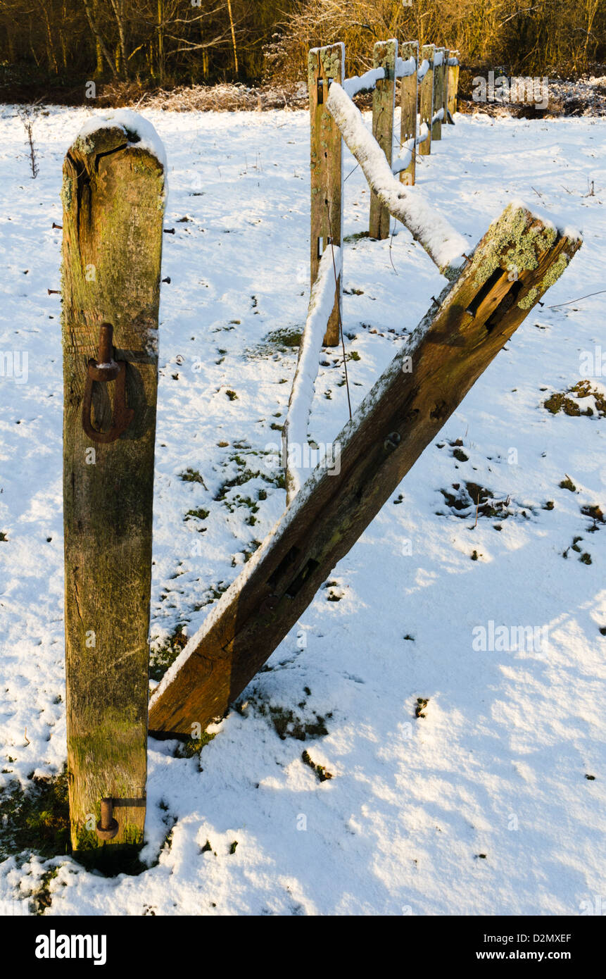Snow on post and rail fence in the countryside Stock Photo