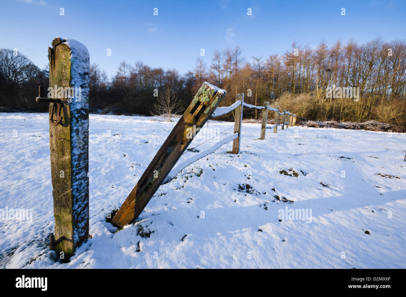 Snow on post and rail fence in the countryside Stock Photo