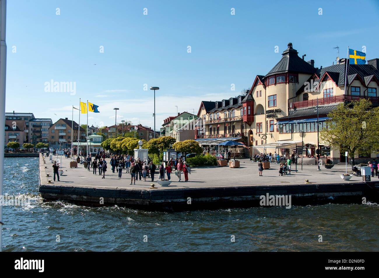 The town of Vaxholm in the Stockholm archipelago as seen from the sea with the Waxholm Hotel in the center Stock Photo
