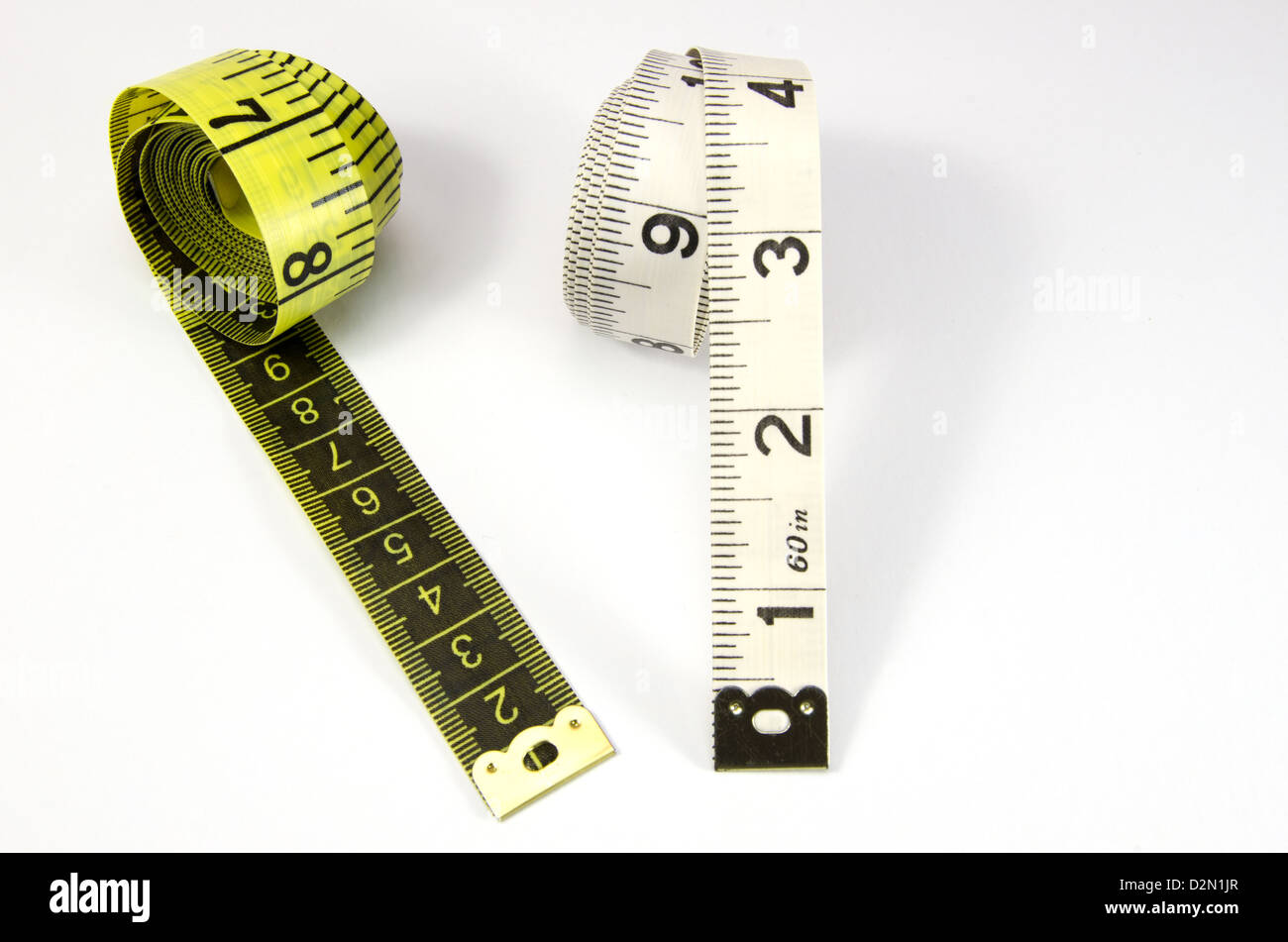 Yellow and white tape measure on white background Stock Photo