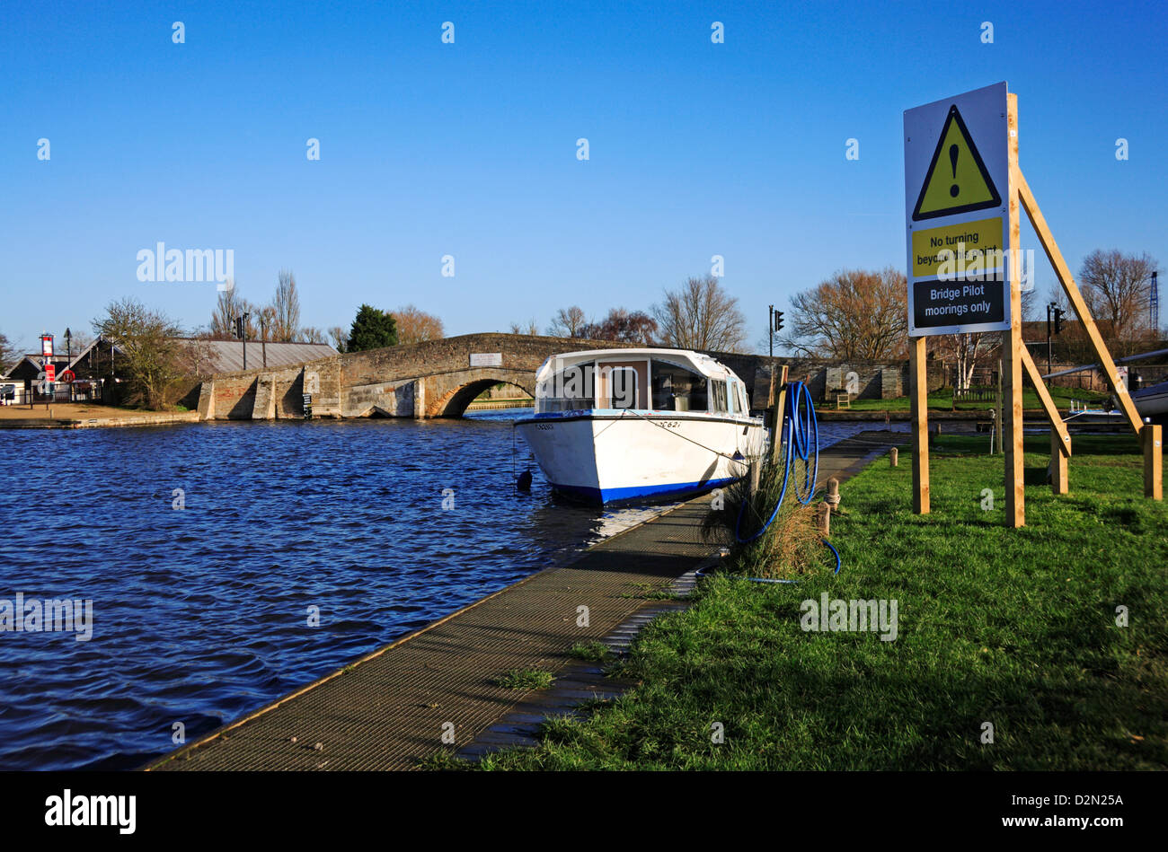 A view of the River Thurne and medieval bridge on the Norfolk Broads at