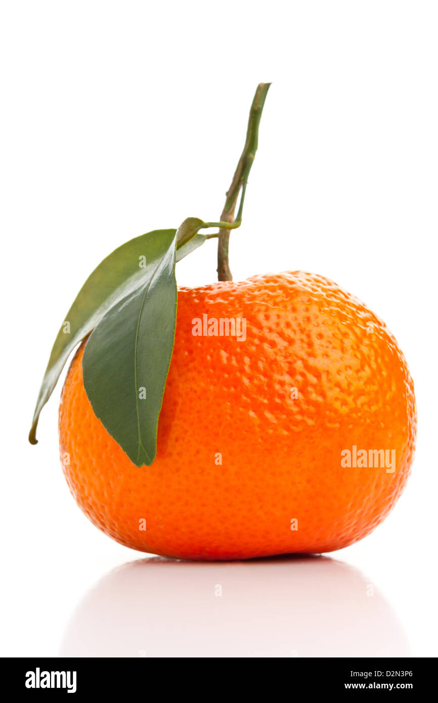 Single whole organic tangerine on white background Stock Photo