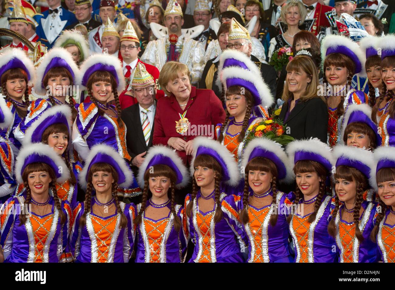 German Chancellor Angela Merkel (C) receives carnival enthusiasts during the traditional carnival reception at the Federal Chancellery in Berlin, Germany, 29 January 2013. Photo: MAURIZIO GAMBARINI Stock Photo