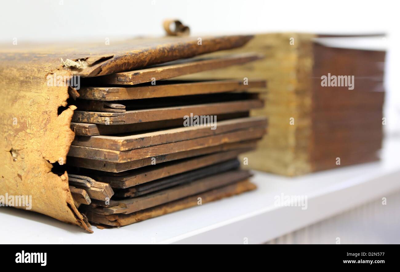 A heavily damamges book of wax tablets from the 17th century sits at the State Archives in Halle