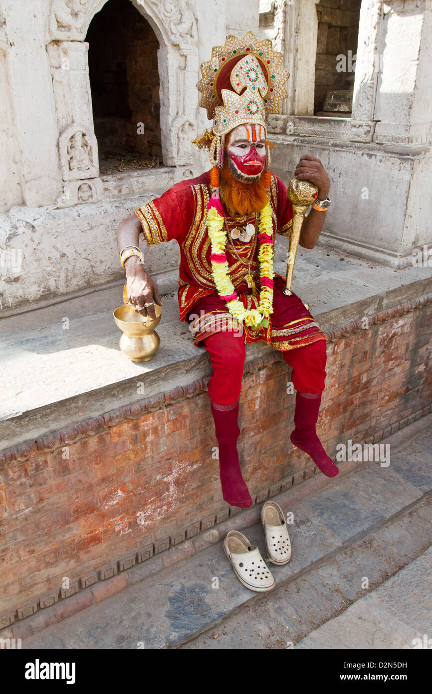 A sadhu hindu holyman dressed as Hanuman monkey god at the Pashupatinath Temple near Kathmandu, Nepal Asia Stock Photo