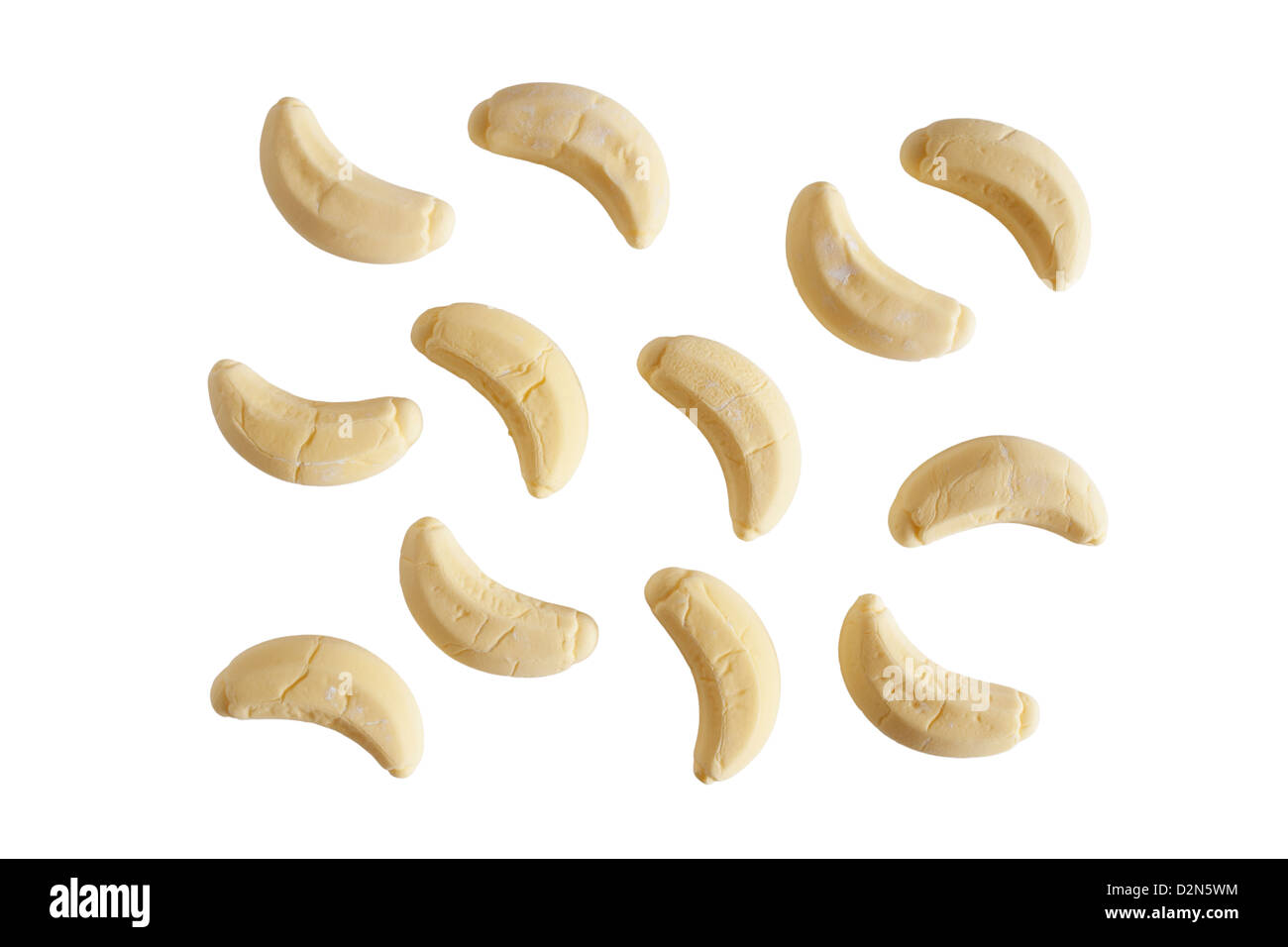 A selection of banana flavour sweets on a white background Stock Photo