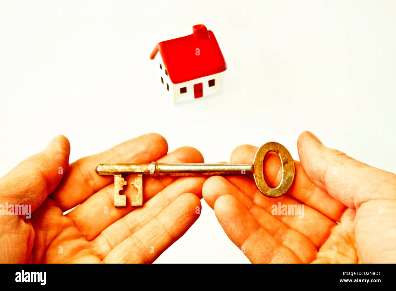 Conceptual shot of a house and a key Stock Photo