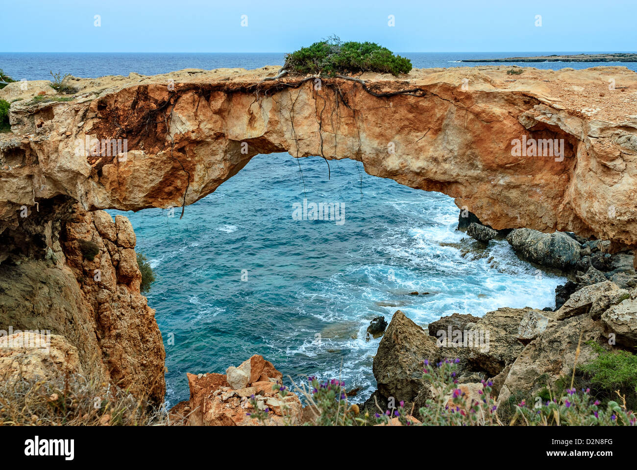 Stone arch over coastline on Cyrpus Stock Photo
