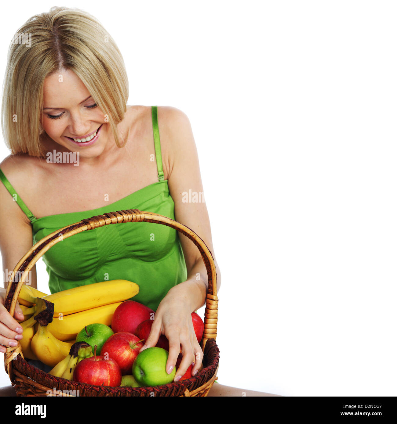 woman holds a basket of fruit on a white background Stock Photo - Alamy