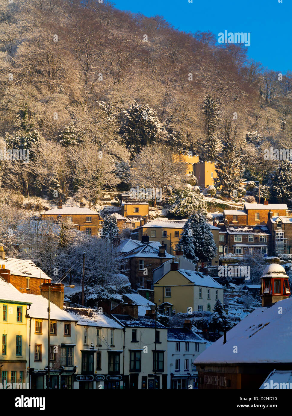 Snow covered houses and shops in Matlock Bath a popular village in the ...