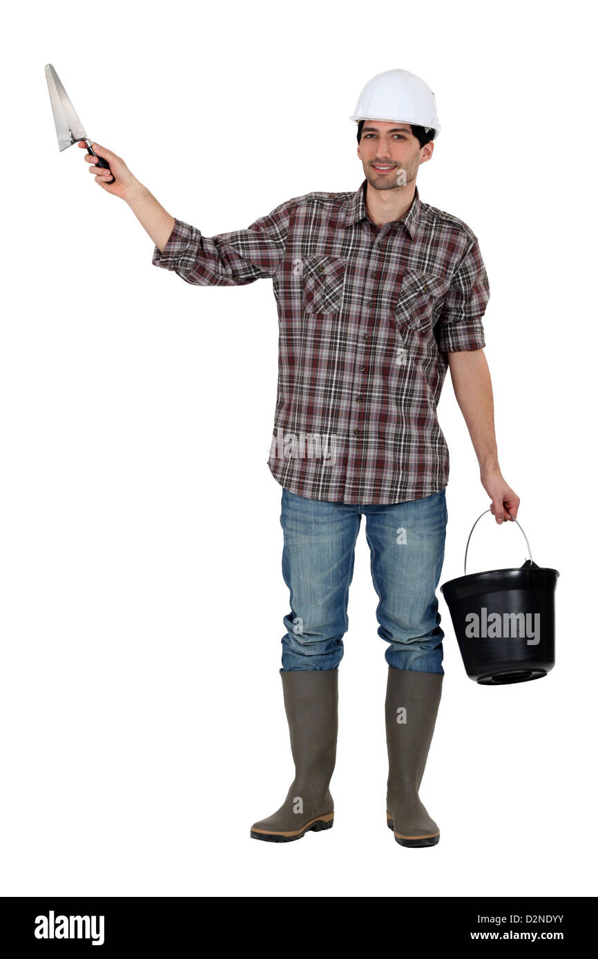 Builder with a trowel and a bucket Stock Photo Alamy