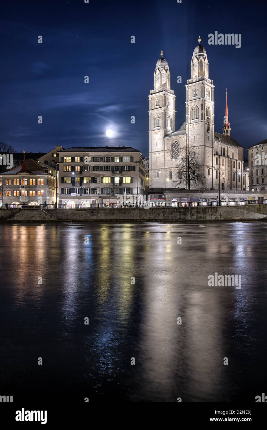 Grossmuenster church and Zurich city center by night. Switzerland. Stock Photo