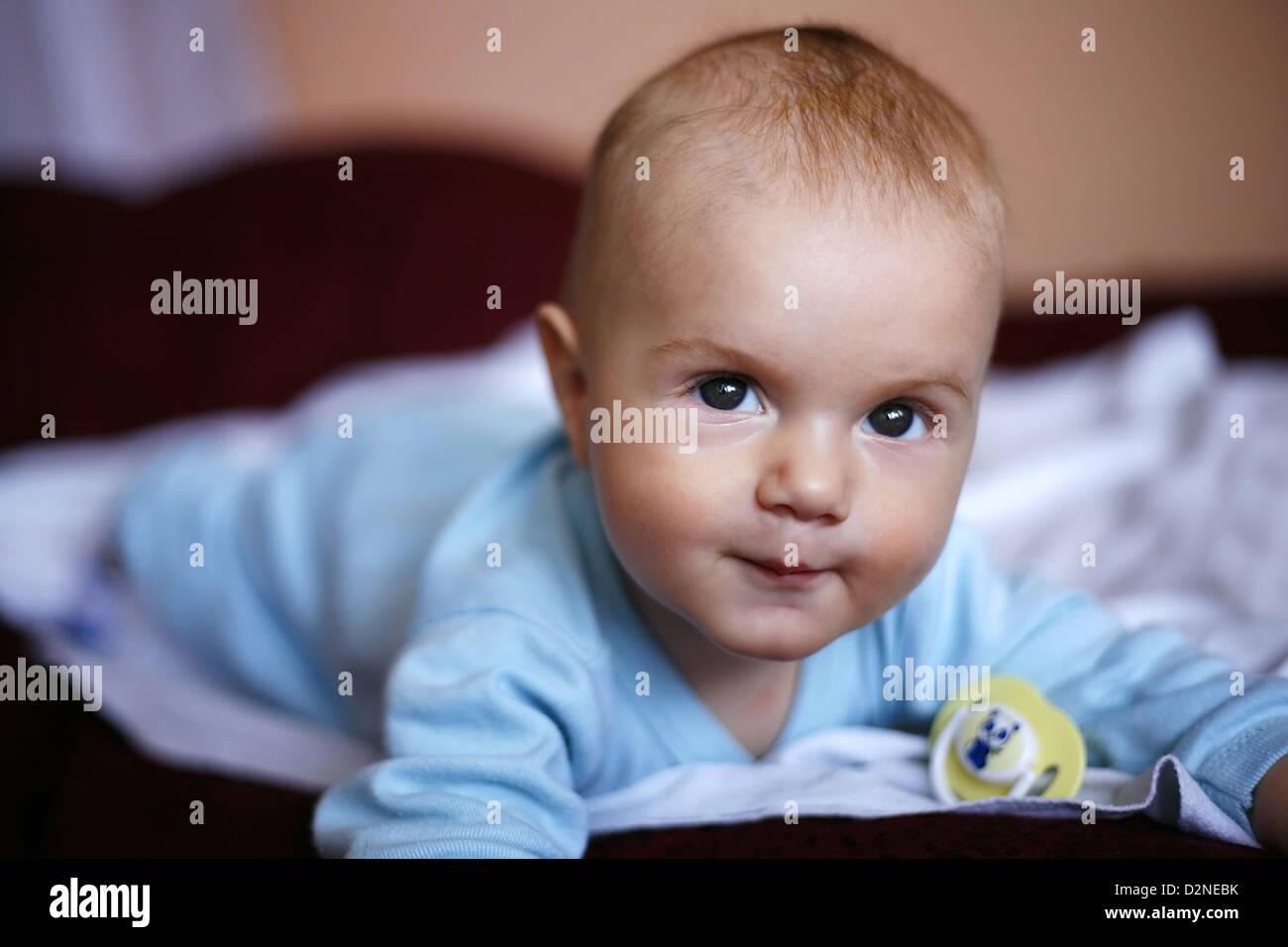 four-monthly new born child in a bed Stock Photo