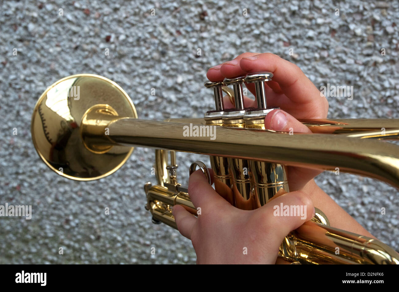 A teenage boy playing a trumpet Stock Photo - Alamy