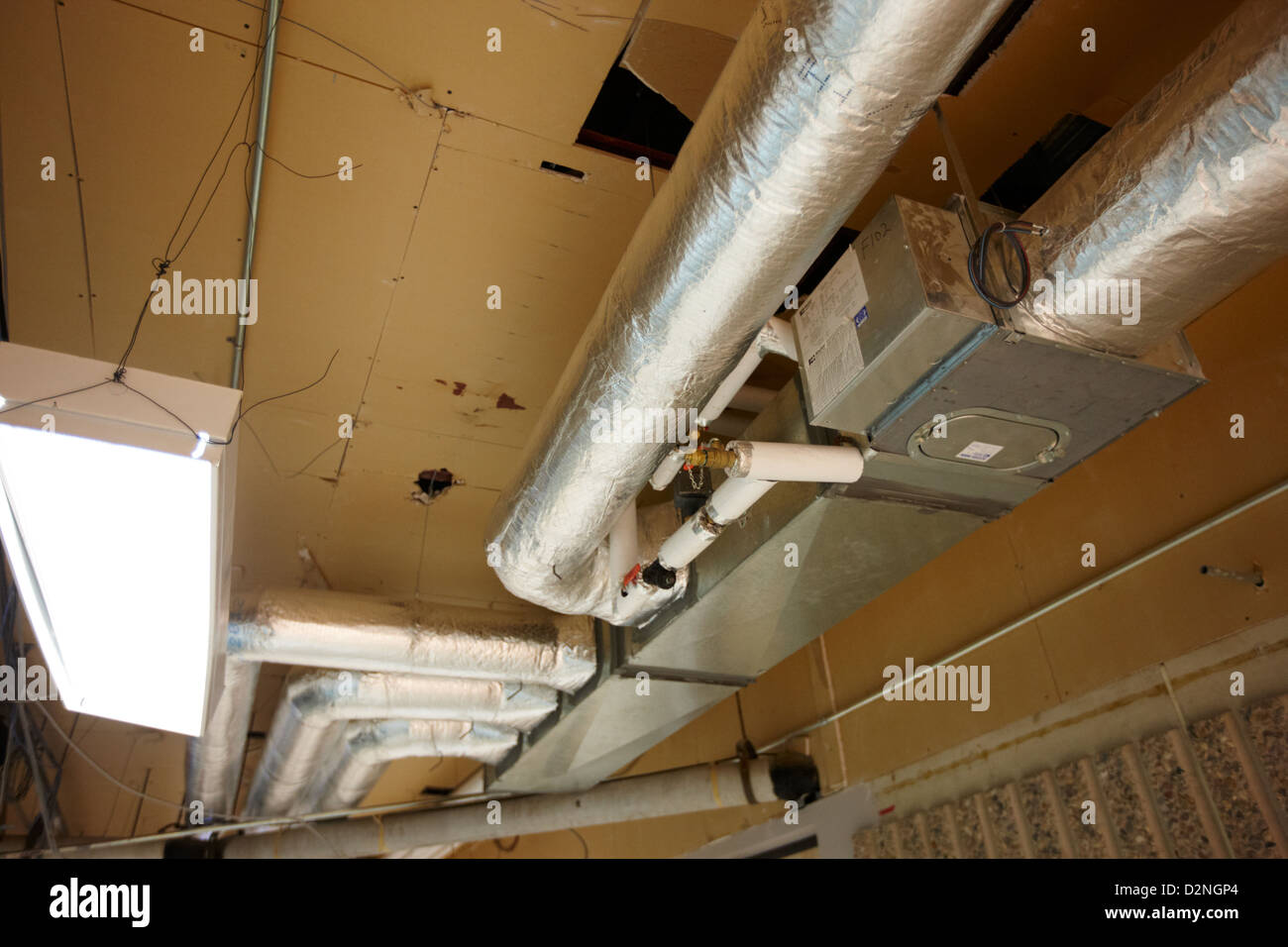 exposed insulated heating and ventilation ducts High school canada north america Stock Photo