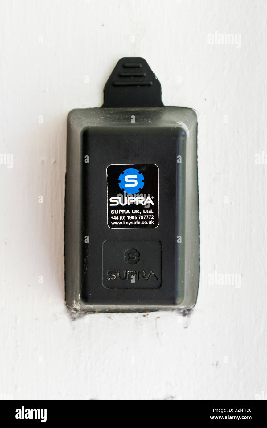A keysafe on the outside wall of a house. Stock Photo