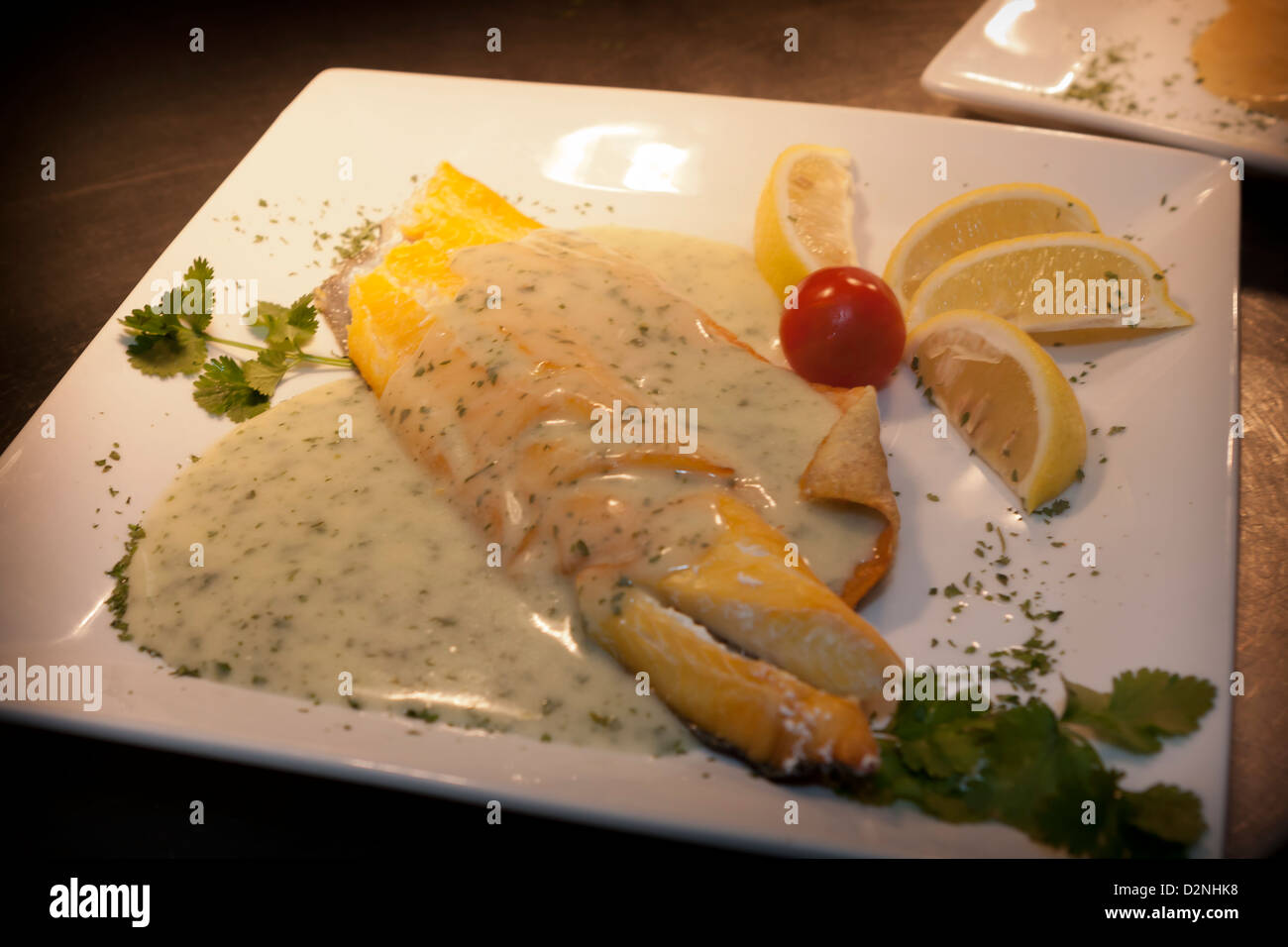 smoked haddock fillet with creamy parsley sauce Stock Photo Alamy