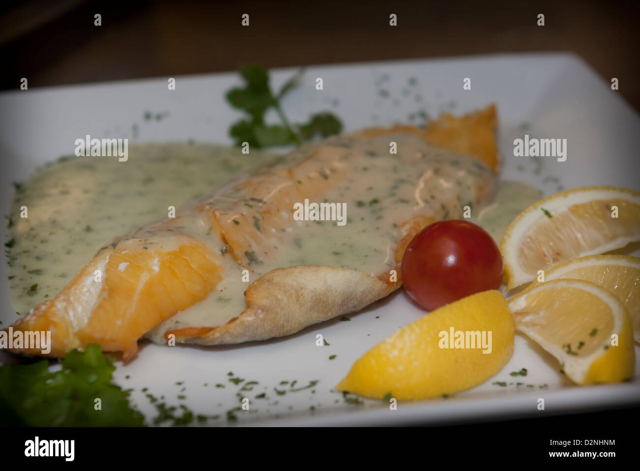 smoked haddock fillet with creamy parsley sauce Stock Photo Alamy