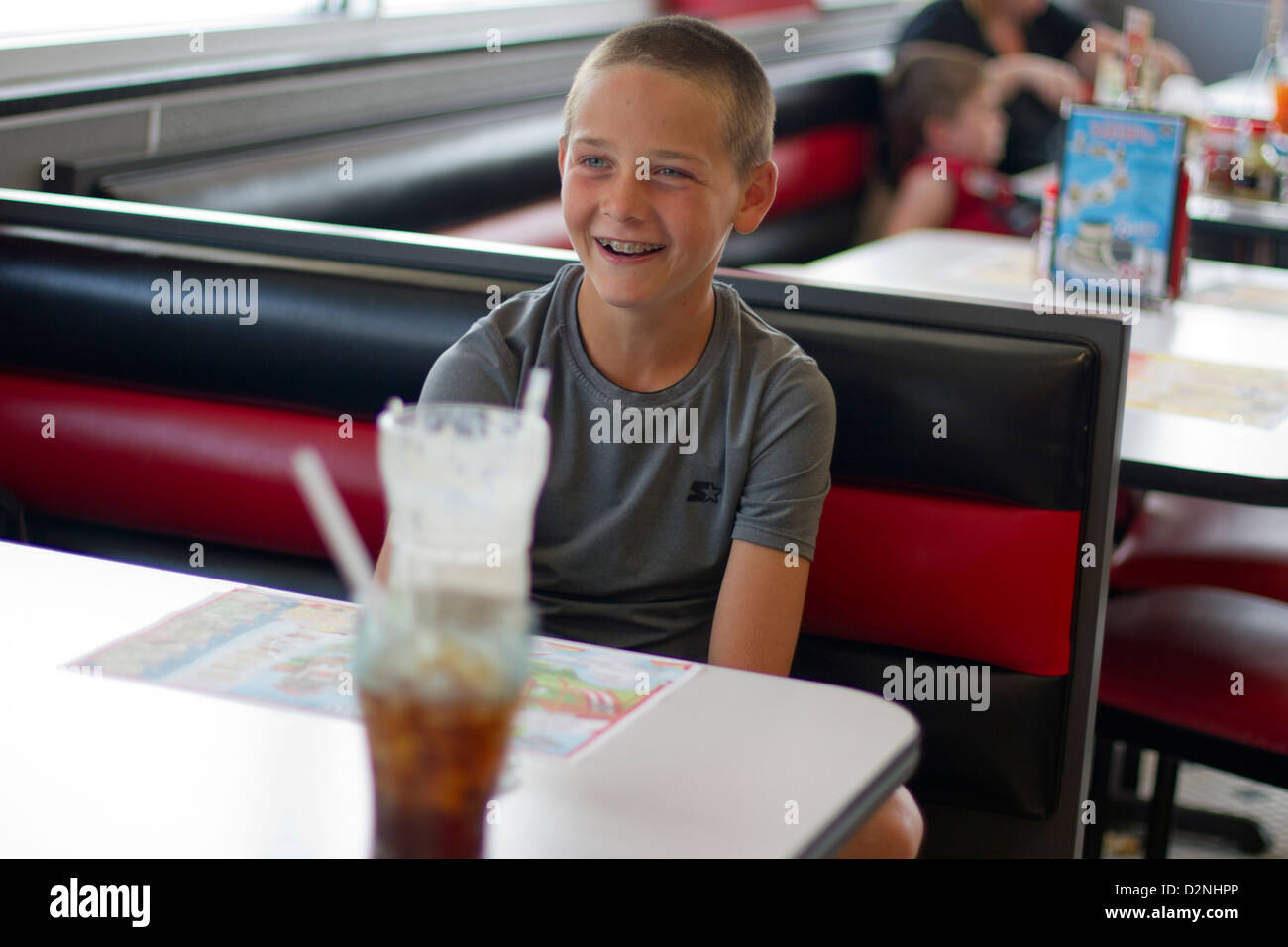 Child in a diner Stock Photo