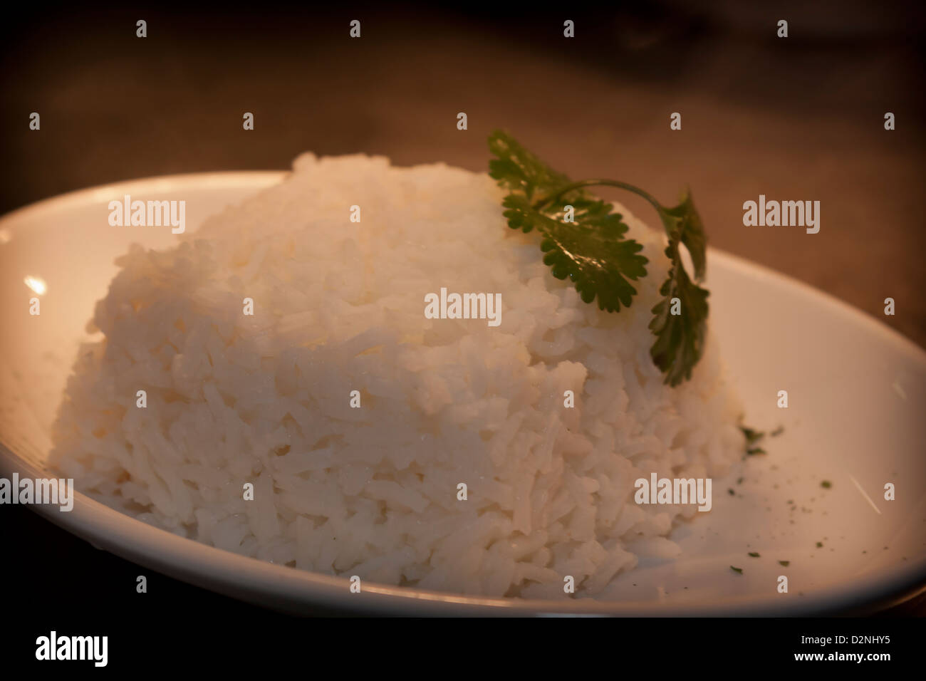 portion of rice on a white plate Stock Photo - Alamy