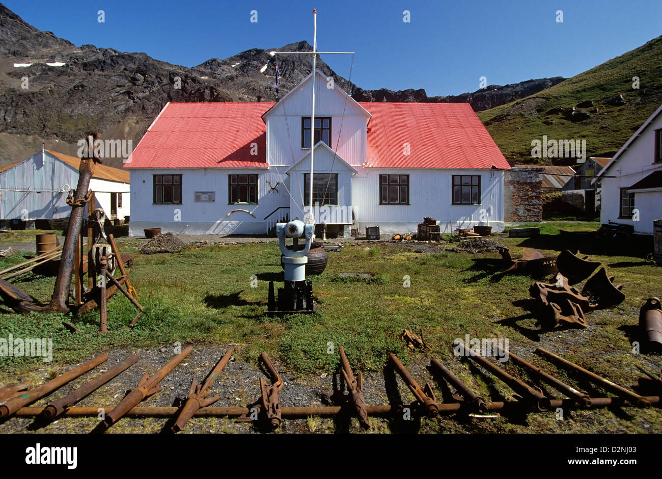 A brightly restored museum sparkles amid the rusty ruins of Grytviken Whailing Station, South Georgia Island, Antarctica. Stock Photo
