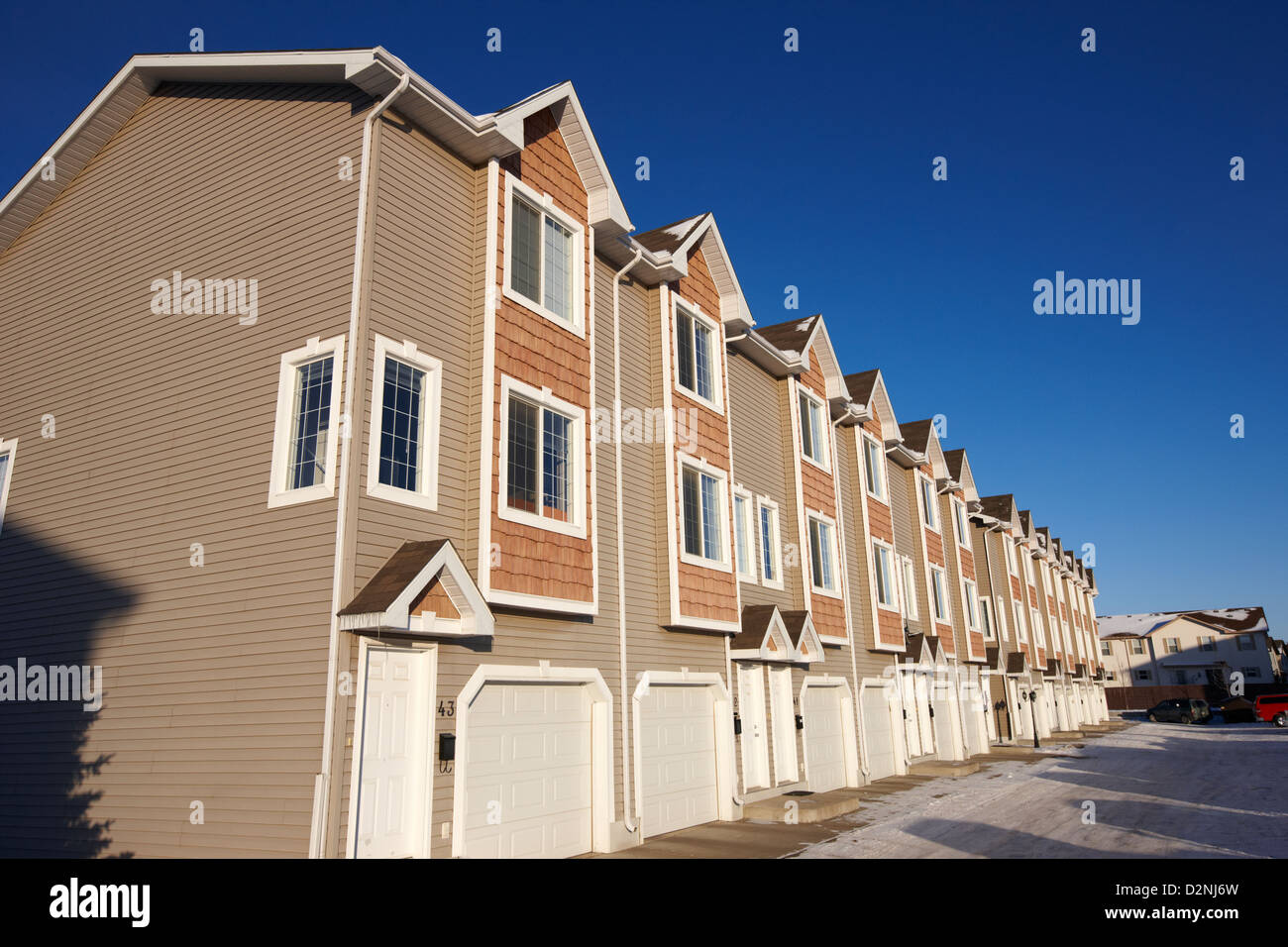 row of condominium starter homes during winter Saskatoon Saskatchewan Canada Stock Photo Alamy