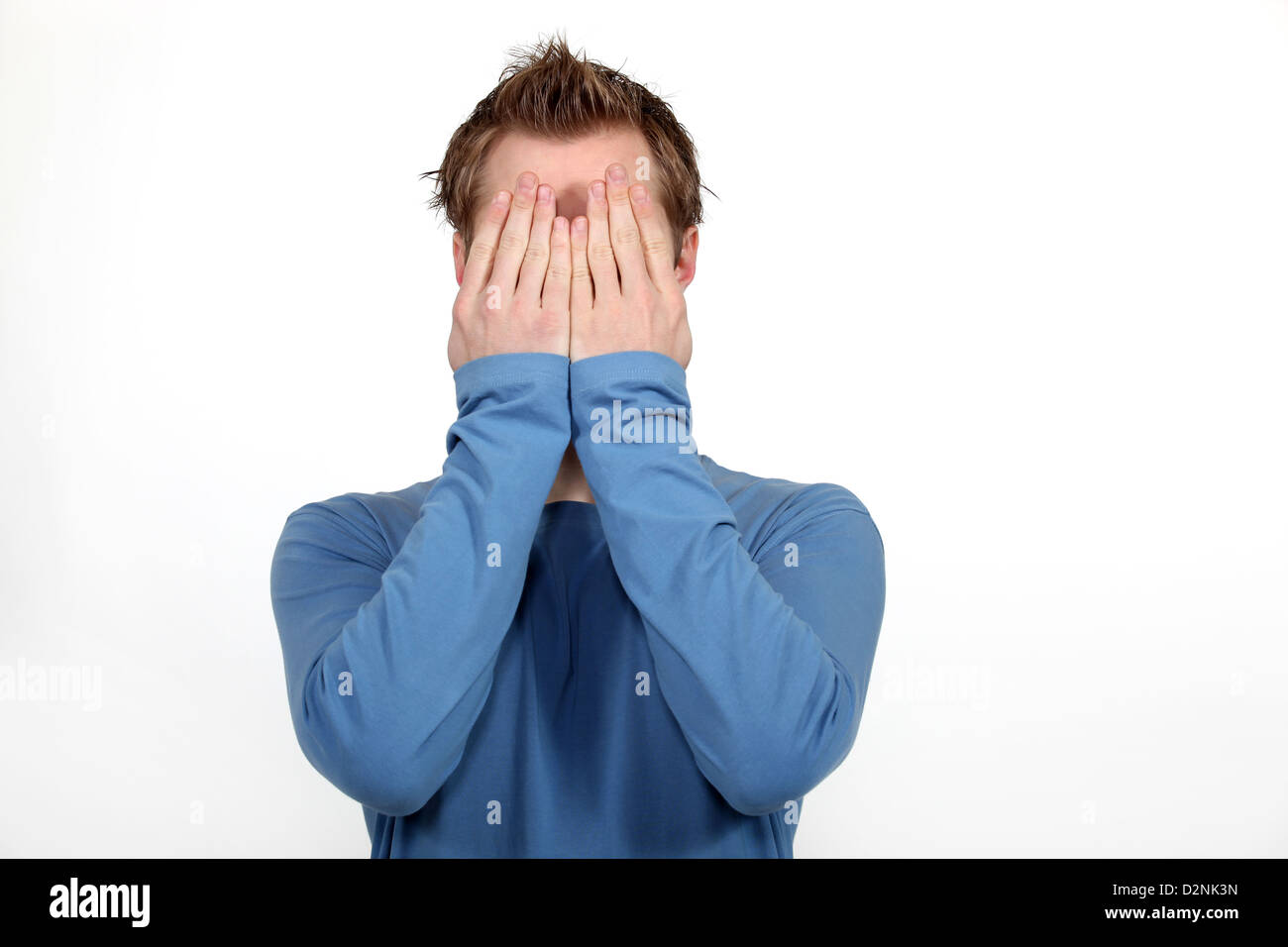 Man covering his face Stock Photo - Alamy