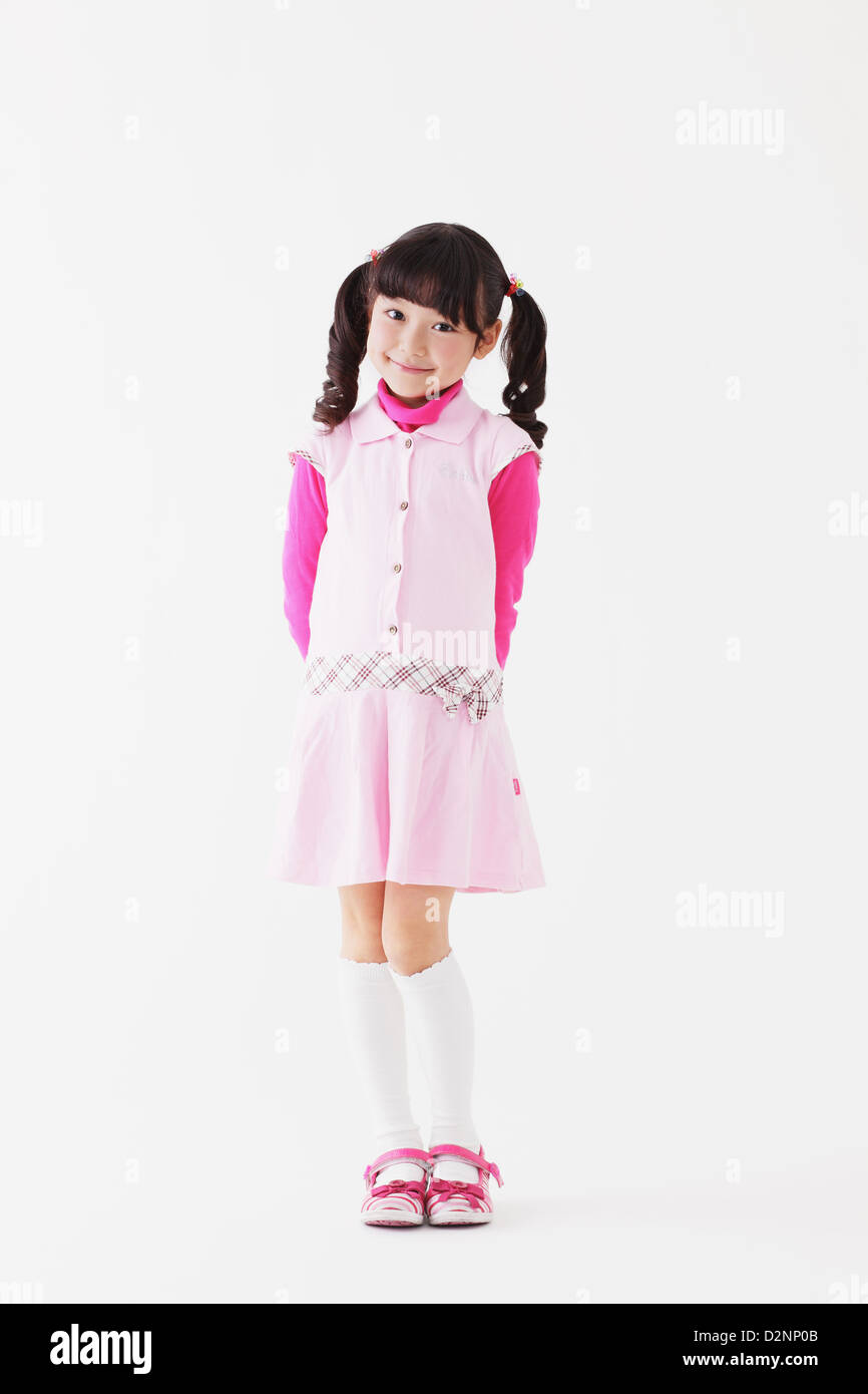 Young girl smiling at camera Stock Photo - Alamy