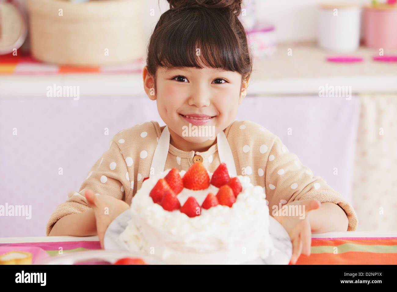 Young girl holding a cake Stock Photo Alamy