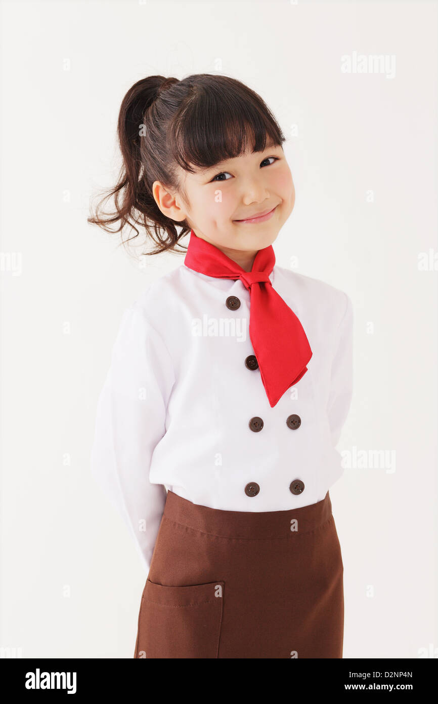 Young girl dressed as a pastry chef posing Stock Photo